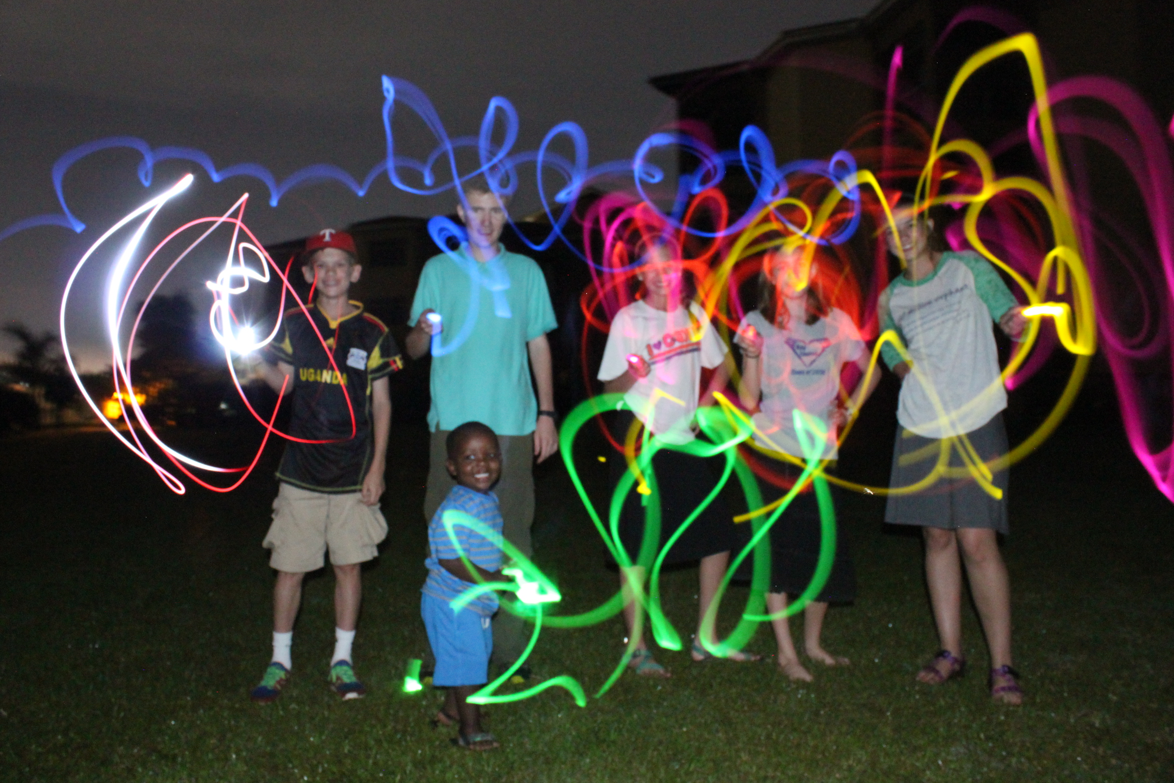 Kids with glow sticks – Divine Collision